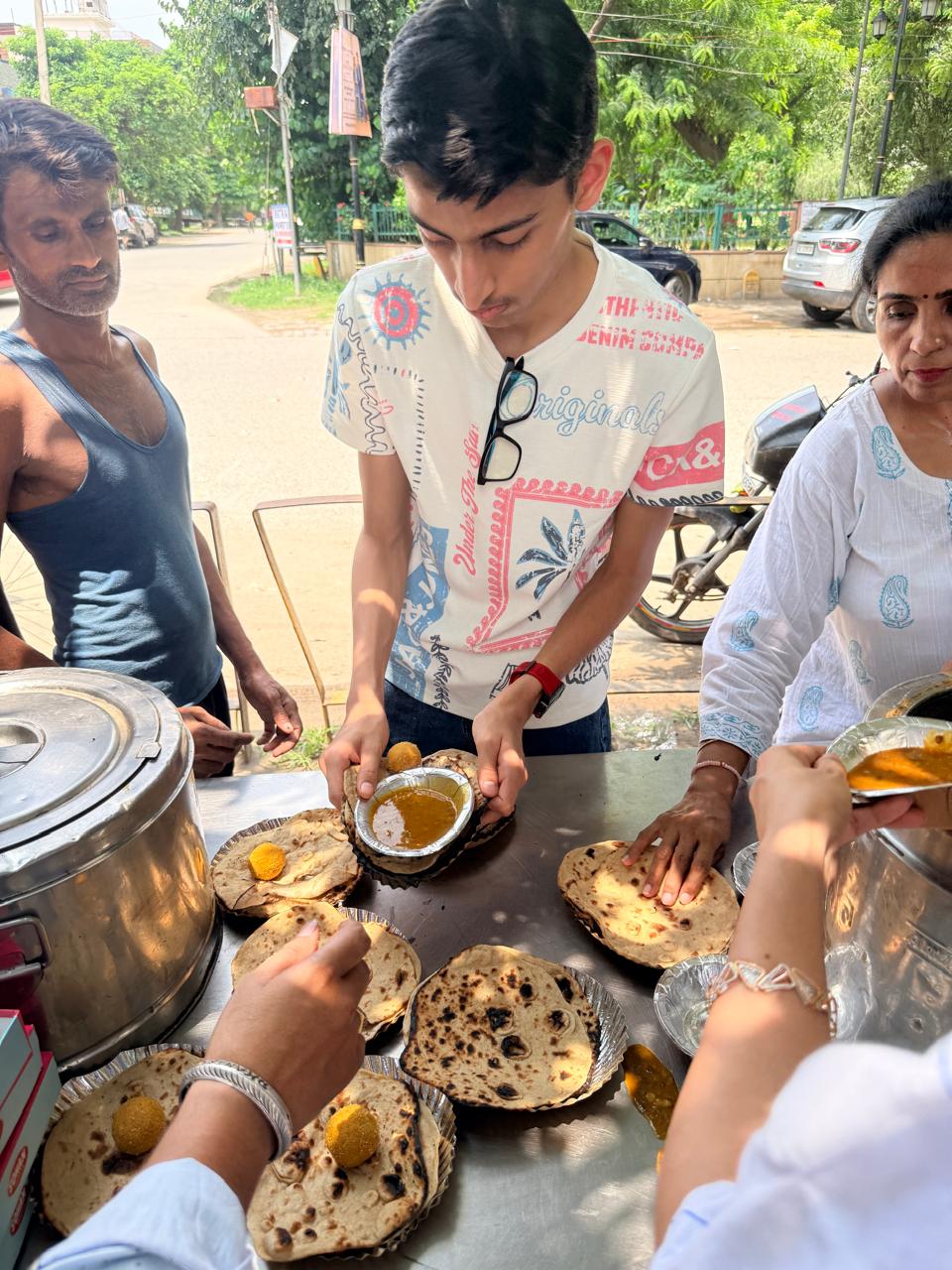 Food plates being assembled and served during Nourish All.